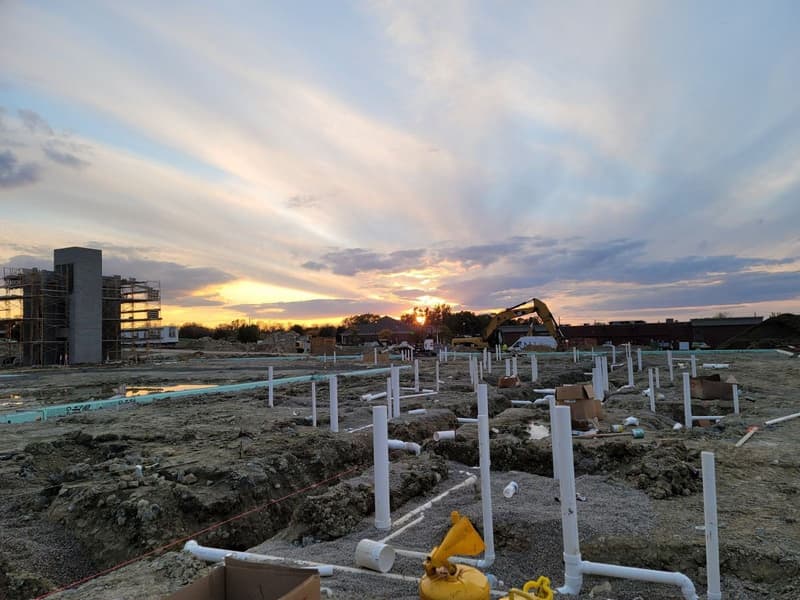Underground plumbing rough-in at sunset